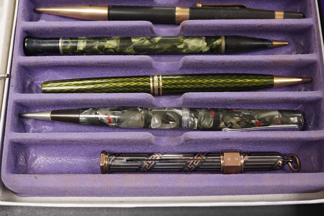 A collection of vintage pencils including an early enamel example